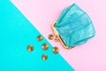 Purse for coins. A leather purse, wallet on a Geometric pink and turquoise background. Trend colors Royalty Free Stock Photo