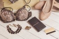 Purse, coins, women clothing and accessories after shopping on wooden background.