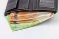 A purse with euro banknotes is bursting at the seams Royalty Free Stock Photo