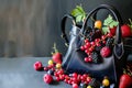 purse overflowing with colorful berries on a table Royalty Free Stock Photo