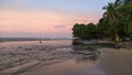 Sunset on the black sand beach of Puerto Viejo, Costa Rica Royalty Free Stock Photo