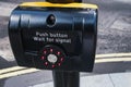 Push button for pedestrian crossing close-up.