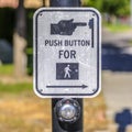 Push button for pedestrian crossing sign on a road Royalty Free Stock Photo