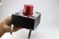 Push button is usually small in size replicated to a large sized switch using cardboard and aluminum foil held in the hand