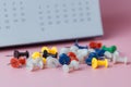 Push pins with blurred calendar