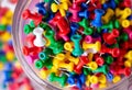 Push Pins A container of push pins in various colors Royalty Free Stock Photo