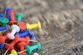 Push pins set on old wooden background Royalty Free Stock Photo