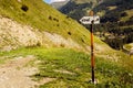 Push scooter direction sign on mountain trail Royalty Free Stock Photo