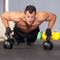 Push up on kettlebells fitness training