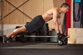 Push up on kettlebells in a gym