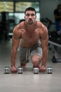Push Ups With Dumbbels Royalty Free Stock Photo