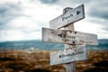 Push your boundaries text on wooden rustic signpost outdoors in nature/mountain scenery. Royalty Free Stock Photo