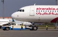 The pushback of A6-AOH Air Arabia Airbus A320-200 aircraft. A ground control manager prepares for departing aircraft from Borispol