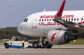 The pushback of A6-AOH Air Arabia Airbus A320-200 aircraft. A ground control manager prepares for departing aircraft from Borispol
