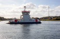 Pusher tug boat floating on the water near a village Royalty Free Stock Photo