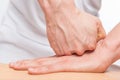 Pushing against sports massage, masseur`s hands