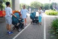 Pushing baby carriages on the sidewalk in Shenzhen, China