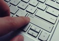 Pushing the break-button on a german silver QWERTZ keybord. Royalty Free Stock Photo