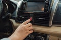Pushing the car emergency button on car dashboard, inside car Royalty Free Stock Photo