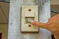 Pushing an electronic doorbell