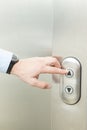 Pushing elevator up button Royalty Free Stock Photo