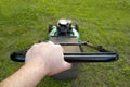 Pushing the Lawn Mower Royalty Free Stock Photo