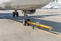 Pushing the plane back the cart tow tracktor on the front landing gear of the chassis. Royalty Free Stock Photo