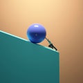 Man pushing a sphere on uphill close to the edge . Royalty Free Stock Photo