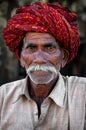 PUSHKAR, INDIA - MARCH 03, 2013: Undefined man with moustache in colourful turban portrait