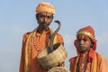 Hindu sadhu holy men and snake cobra in desert Thar on time Pushkar Camel Mela near holy city Pushkar, Rajasthan, India Royalty Free Stock Photo