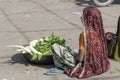 Food trader selling vegetables in street market. Pushkar, Rajasthan, India