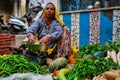 Woman street vegetable vendor selling vegetables in the street of Pushkar, Rajasthan, India