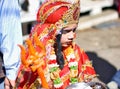 Pushkar, India: A young little girl dressed up or disguised as Indian goddess with crown, red dress and Royalty Free Stock Photo