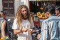 Tourist buying fruits on public market