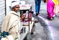 Pushkar,Rajasthan /India. 06 /11/2019. Indian Beggar Taking a cup of Tea at Streets of Pushkar During Pushkar Fair