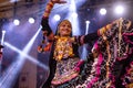 Female artist performing kalbelia dance in pushkar fair