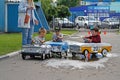Children driving Soviet pedal cars `Moskvich` at the festival `Retrosummer` in Pushkino