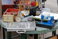 Still life of old clock, sewing machine, book, signal flasher, radio receiver at the flea market at the festival `Retrosummer` in Royalty Free Stock Photo