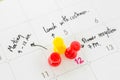 Pushpin on calendar with busy day. Royalty Free Stock Photo