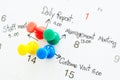 Pushpin on calendar with busy day. Royalty Free Stock Photo