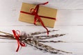 Pussy Willow Twigs And Cardboard Gift Box On White Wooden Table. Top View