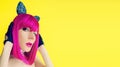 Pussycat lady in bright wig on yellow background Royalty Free Stock Photo