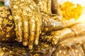 Put gold leaf onto The Buddha statue to gild. Which people use t