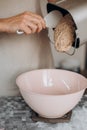 Put kneaded dough round form making bread Royalty Free Stock Photo