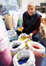 Put some color into it. A plastics factory owner inspecting his merchandise.