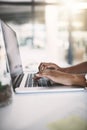 Put in the work, reap the rewards. a businesswoman using a laptop at her desk in a modern office. Royalty Free Stock Photo