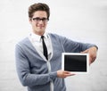 Put your text in his capable hands. A nerdy guy holding a digital tablet.