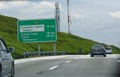 Putrajaya, Malaysia--March 2018: Directional billboard on the road with directions and distances to Komplex Sukan Negara and other