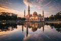 PUTRAJAYA, MALAYSIA - NOVEMBER 29, 2015 : Ray of light captured during sunrise and lake reflection at Putrajaya mosque, Malaysia