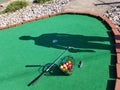 Putt Putt mini golf colorful balls clubs shadow Royalty Free Stock Photo